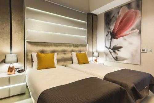Ένα ή περισσότερα κρεβάτια σε δωμάτιο στο Hotel Edma