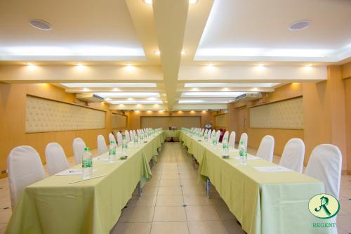 a row of tables with chairs and water bottles on them at Regent Ramkhamhaeng 22 in Bangkok