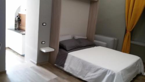 a small bedroom with a bed in a room at Suite 30 mq in Palo del Colle