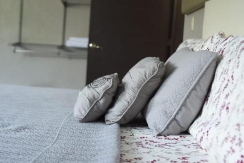 Cama o camas de una habitación en Garden Suites Tonala