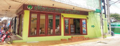 a store front of a restaurant on a street at Chiangkhong Green Inn Resident in Chiang Khong