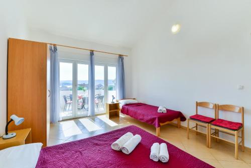 Postel nebo postele na pokoji v ubytování Apartments Lavanda