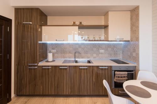 a kitchen with a sink and a counter at City Apartments Triumph in Varna City