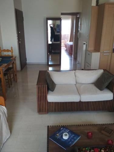 a living room with a couch and a table at George's Apartment in Athens