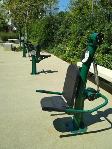 a row of exercise equipment in a park at George's Apartment in Athens