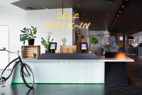 a bike parked in front of a counter in a store at Comfort Hotel RunWay in Gardermoen