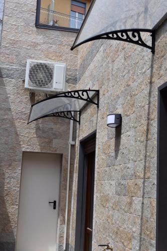 a building with a air conditioner on the side of it at Casa Aci GioJa in Aci Catena