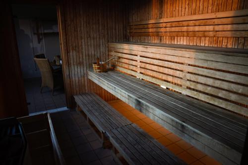 a wooden bench in a room with at Best Western Malmia Hotel in Skellefteå