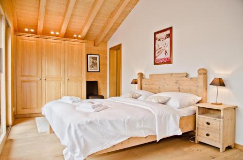 Ein Bett oder Betten in einem Zimmer der Unterkunft Apartment Bäreggblick - GRIWA RENT AG