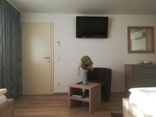 Una televisión o centro de entretenimiento en Appartments Gartenblick
