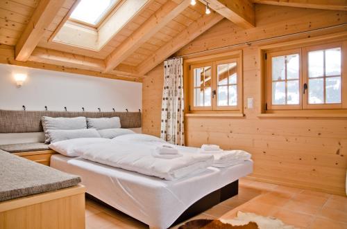Postel nebo postele na pokoji v ubytování Apartment Bärgrose - GRIWA RENT AG