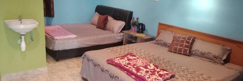 Кровать или кровати в номере Mazza Nur Motel
