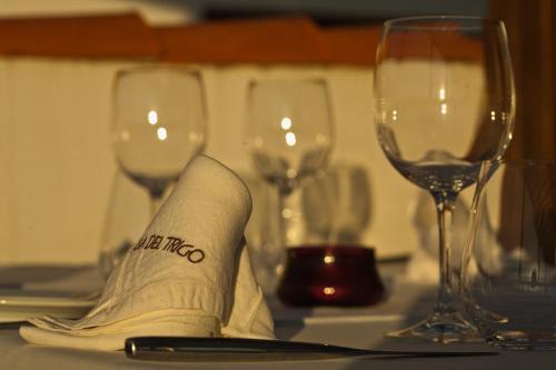 a napkin with the word mezzo sits on a table with wine glasses at Casa del Trigo in Santa Fe