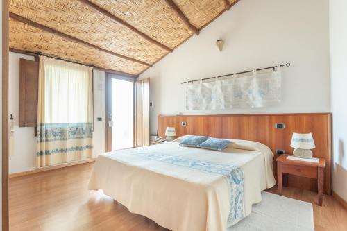 Cama o camas de una habitación en Hotel Villa Canu