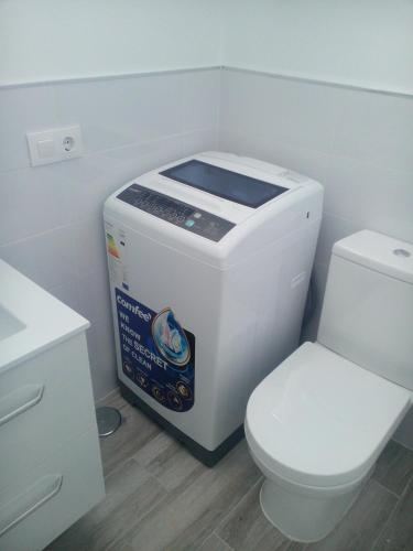 a bathroom with a toaster and a toilet at Apartment Island Paradise in Adeje