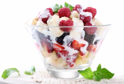a plastic cup of fruit salad with berries and whipped cream at Carslogie House in Port Elizabeth