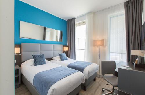 Ένα ή περισσότερα κρεβάτια σε δωμάτιο στο Les Terrasses d'Eze - Hôtel & Spa