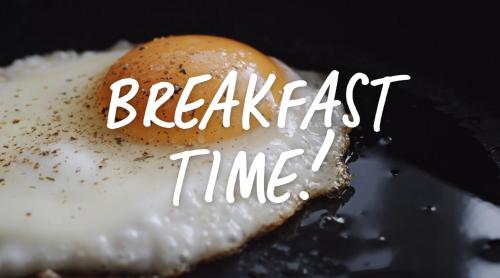 a fried egg with the words breakfast time on it at Best Western Malmia Hotel in Skellefteå