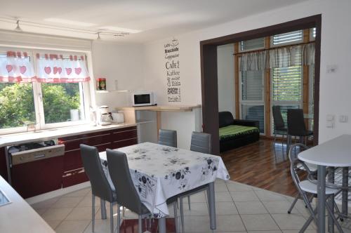 a kitchen and dining room with a table and chairs at Ferienhaus Steyrdurchbruch in Leonstein
