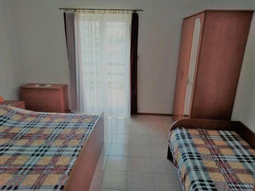 Postel nebo postele na pokoji v ubytování Apartment More OTOK Žirje