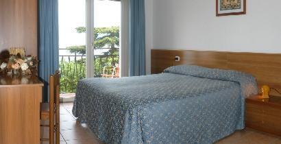 Postel nebo postele na pokoji v ubytování Hotel Residence Sirenella