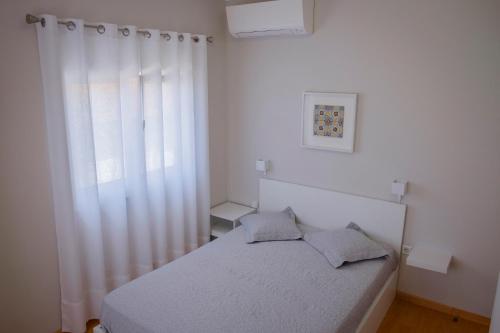 Postel nebo postele na pokoji v ubytování Maiahouse