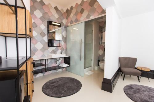a bathroom with a sink and a toilet at Hotel Rum Budapest in Budapest