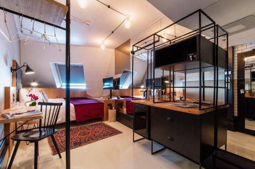a room with a bed and a desk with a chair at Hotel Rum Budapest in Budapest