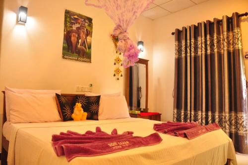 Postel nebo postele na pokoji v ubytování Sigiri Saman Home Stay