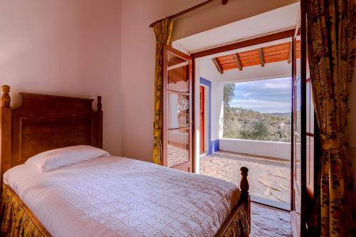 Un pat sau paturi într-o cameră la Monte da Lapa