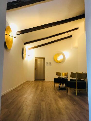 an empty room with a table and chairs at Palazzo Otello 1847 Wellness & Spa in Vicenza