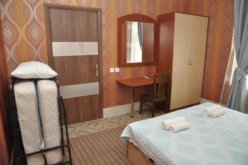 Postel nebo postele na pokoji v ubytování Apartments Firuze