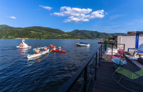 a group of people in boats on a lake at Casa Andrei in Orşova