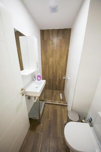 a bathroom with a toilet and a sink at Greenland Premium Residance in North Nicosia
