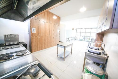 a kitchen with a stove and a table in it at Greenland Premium Residance in North Nicosia