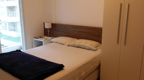 เตียงในห้องที่ Jd. S. Lourenço - Riviera - Novo, 3 dorm, AC, 300m do mar, serviço de praia