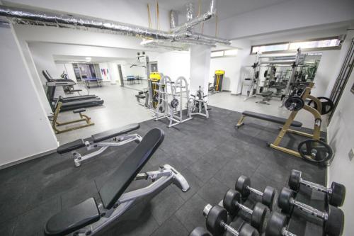 a gym with several treadmills and machines in it at Greenland Premium Residance in North Nicosia