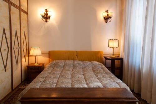 Tempat tidur dalam kamar di Casa Archè