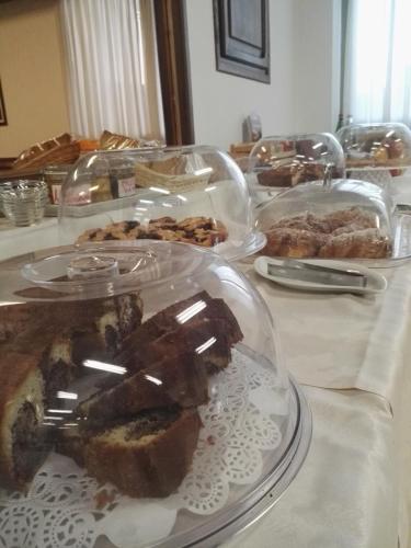 a table with several trays of food on it at Villa La Rena in Anagni