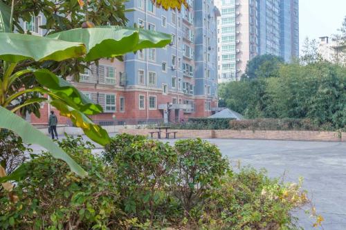 a parking lot in a city with tall buildings at Wuhan Wuchang·Wuchang River Beach· Locals Apartment 00139250 in Wuhan