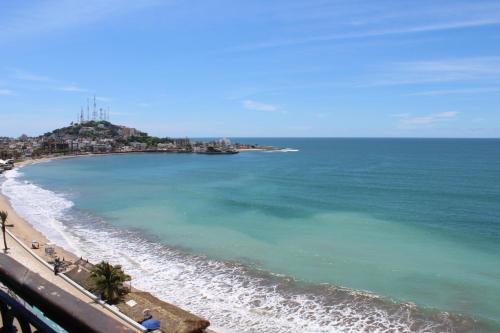 a view of a beach with the ocean at Hotel Playa Marina in Mazatlán
