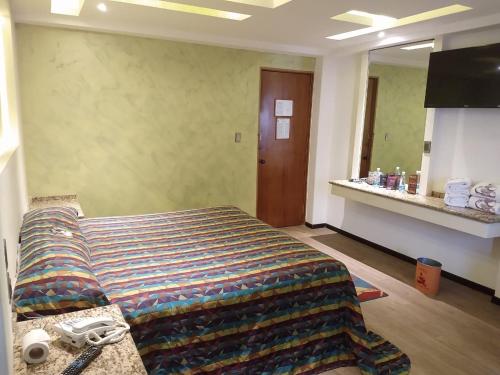 Ένα ή περισσότερα κρεβάτια σε δωμάτιο στο Hotel Siesta del Sur