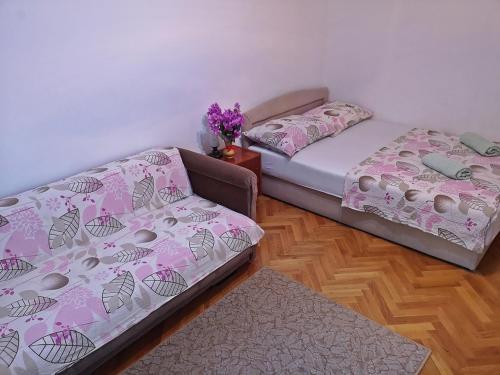 Cama o camas de una habitación en Apartments Neven