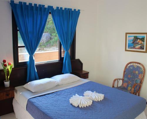 Cama ou camas em um quarto em Hotel Bela Onda