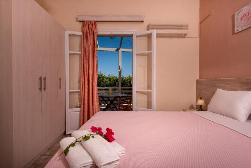 Ένα ή περισσότερα κρεβάτια σε δωμάτιο στο Vasiliki Apartments