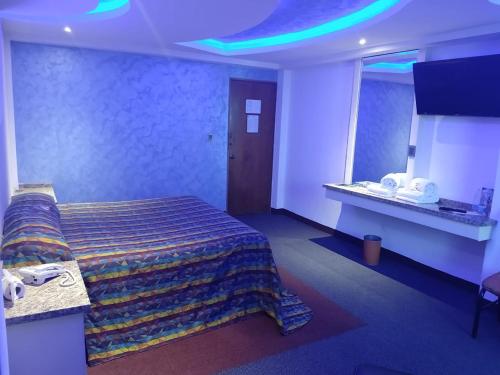 Ένα ή περισσότερα κρεβάτια σε δωμάτιο στο Hotel Siesta del Sur