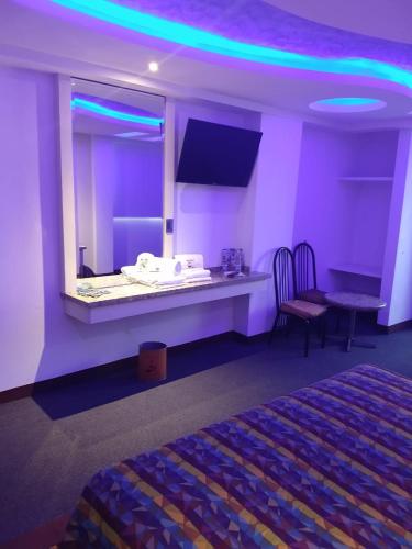 Ένα ή περισσότερα κρεβάτια σε δωμάτιο στο Hotel Siesta del Sur