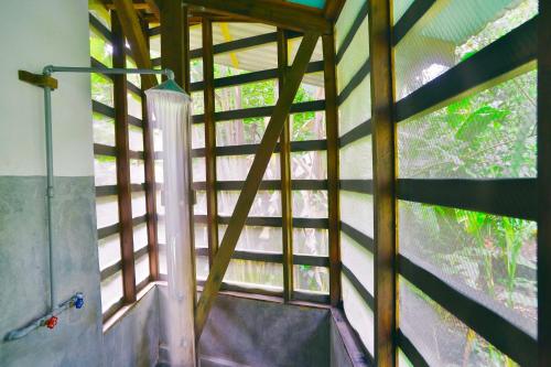 a view from the inside of a room with a window at La Kukula Lodge in Puerto Viejo