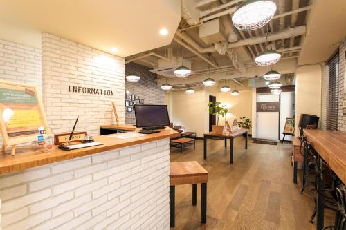 an office with a counter and a desk with a computer at Hotel Double Funabashi in Funabashi