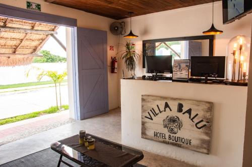 a living room with a door and a table at Hotel Boutique Villa Balu in Bacalar